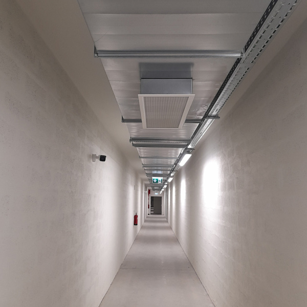 Corridor with exposed piping